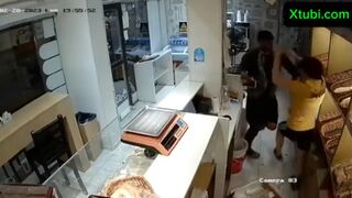 Employee defends herself with a knife from a robbery in bakery.